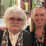 Lorilee smiling beside Sir Karl Jenkins